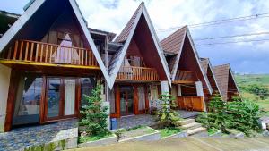 a row of houses with balconies on them at Zaada Villa Dieng Syariah By Travelink in Kejajar