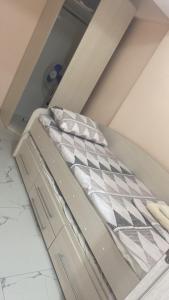 a small bed in a small room with at Полёт in Chişinău