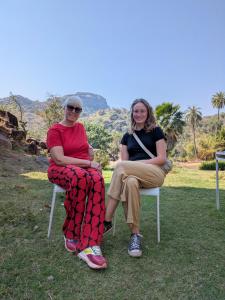 two people sitting on chairs in the grass at Nomada in Mount Ābu +15 photos