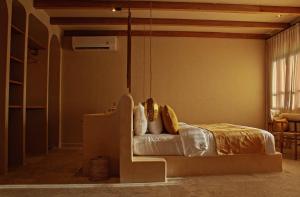 a bedroom with a bed in a room at Kumbara Oasis Lombok in Kuta Lombok