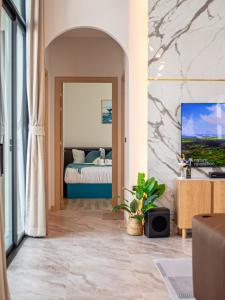 a bedroom with a bed in a room at Gam-Hom Poolvilla ชะอำ in Ban Hua Phrong +150 photos