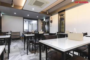 a dining room with tables and chairs at Jinju KAI Tourist Hotel in Jinju