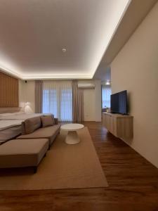 a large living room with a couch and a tv at Lan Cheng Su in Yuanshan