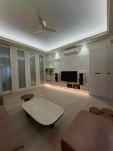 a living room with a ceiling fan and a fireplace at Lan Cheng Su in Yuanshan +10 photos