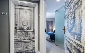 Uma cama ou camas num quarto em Lisbon Sao Bento Hotel