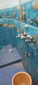 an underwater bathroom with a sink and an aquarium at Meena Sadan in Prayagraj