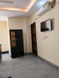 a room with a flat screen tv on the wall at RSR event service in Faridabad