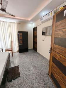 a room with a wooden door and a room with at RSR event service in Faridabad
