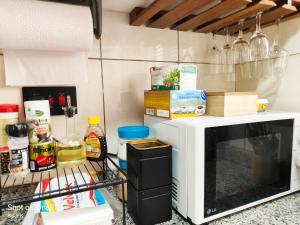 a microwave oven sitting on top of a counter at Twiga Luxe in Arusha +19 photos