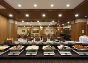 a buffet of food on a table in a restaurant at Toyooka Green Hotel Morris in Toyooka