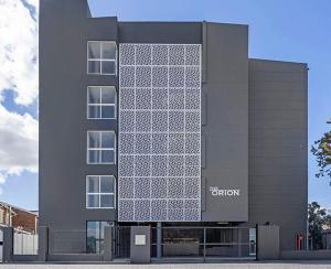 a building with a lot of windows on it at Table Mountain View Apartment II in Cape Town