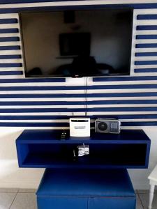 a blue dresser with a camera on top of it at Happy Jack - Margate in Margate