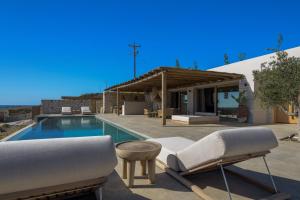 a villa with a swimming pool and a house at Villa Noema in Agiassos