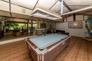 a pool table in the middle of a living room at Phangan Beach Resort in Ban Tai