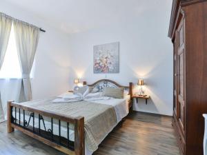 a bedroom with a large bed in a room at Marinic Comfortable holiday residence in Zadar +32 photos