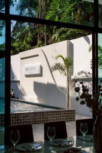 a restaurant with a table and a sign that reads the law at THE I-CON Luxury PoolVilla Pattaya Ocean Yacht Club 10 Bedrooms in Ban Huai Yai