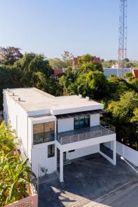 an aerial view of a white house with trees at THE I-CON Luxury PoolVilla Pattaya Ocean Yacht Club 10 Bedrooms in Ban Huai Yai +144 photos