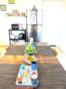 a table with a tray of food on top of it at Gîte Délia Les Makes in Saint-Louis