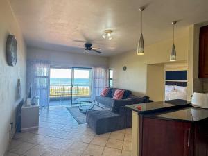 a living room with a couch and a table at 28 Breaker View 3-bedroom beach apartment in Durban