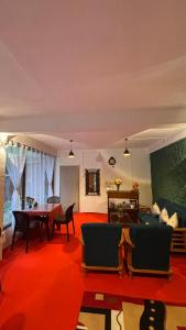 a living room with a couch and a table at Laalsa Retreat in Darjeeling