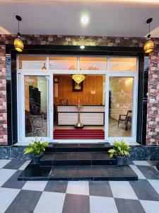 a church entrance with a cross in the window at G Mount inn in Munnar