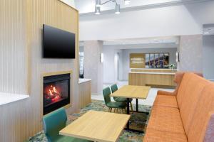 a living room with a couch and a fireplace at Hampton Inn & Suites-Austin Airport in Austin