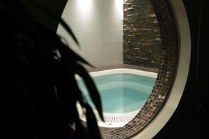 a round bath tub in a bathroom with a window at Scandic Karlstad City in Karlstad