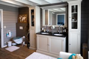 a bathroom with two sinks and a toilet at Stijl en kleur in Diest +173 photos