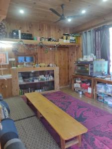 a living room with a wooden table and shelves at The Quiet Corner in Gushaini +37 photos