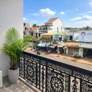 a balcony with a view of a city at Kim Ngân Hotel Buôn Ma Thuột in Buon Ma Thuot