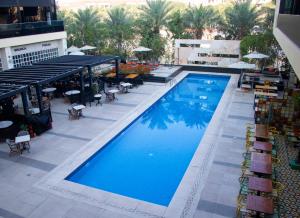 an overhead view of a swimming pool on top of a building at Studio One Hotel in Dubai