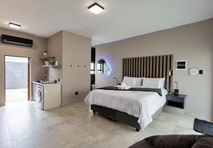a bedroom with a large bed in a room at Grey Luxury Accommodation Langebaan in Langebaan