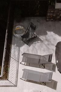 two chairs and a table on a patio at Villa Elena in Menaggio