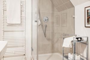 a bathroom with a shower with a glass door at Müllerhaus - Ostholstein in KÃ¶hn +39 photos