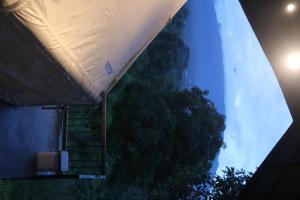 an overhead view of a tent next to a tree at Arjuno Chatten Valley in Punten