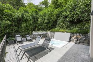 a group of chairs sitting on a patio at Villa Elena in Menaggio