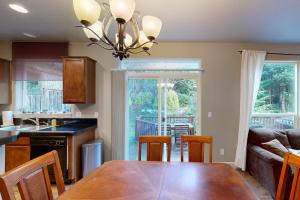a kitchen and dining room with a table and chairs at Sundown Lagoon in Tillamook