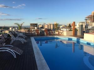 a swimming pool on the roof of a building at Aires de la Villa in Villa Carlos Paz