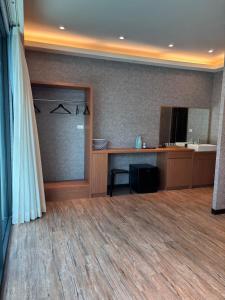 a room with a desk and a mirror at 夏日微醺二館 in Hengchun South Gate +16 photos