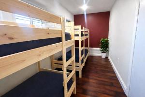 a group of bunk beds in a room at Vernon Vibes in Los Angeles