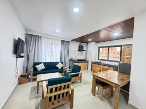a living room with a couch and a table at HB Apartment in Thimphu in Thimphu