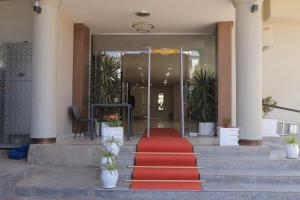 a red carpet on the stairs of a building at History Hotel in Dirē Dawa