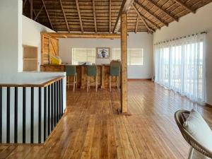 a living room with a table and chairs in it at Old Harbour Place in Gansbaai