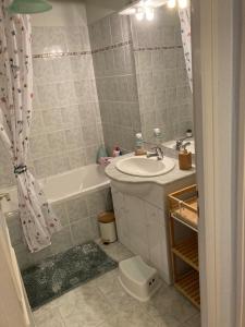 a bathroom with a sink and a bath tub at Macasa chambres et table d'hôte in Coolus +43 photos
