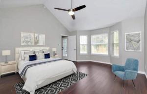 a bedroom with a bed and a ceiling fan at Amazing Home in Fort Worth