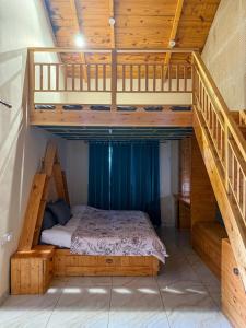 a bedroom with a bunk bed in a house at Saffron 2 Bedroom Duplex Villa in Mukteshwar