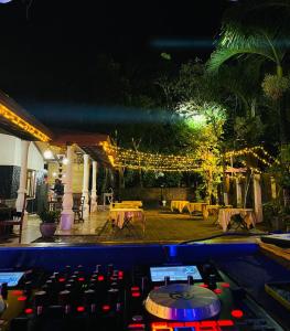 a view of a patio at night with lights at Deanna Inn in Anuradhapura