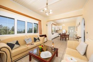 a living room with a couch and a table at Villa Stephania in Gaios
