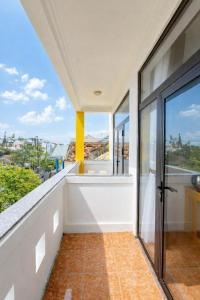 an empty balcony with a view of the city at Sea and Sand Hotel in Hoi An
