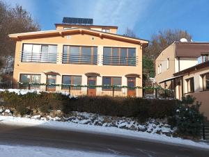 a house with a solar panel on top of it at Wellness rezort Maxim Bojnice in Bojnice